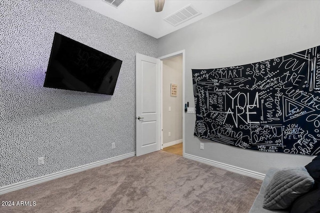 bedroom featuring ceiling fan and carpet floors