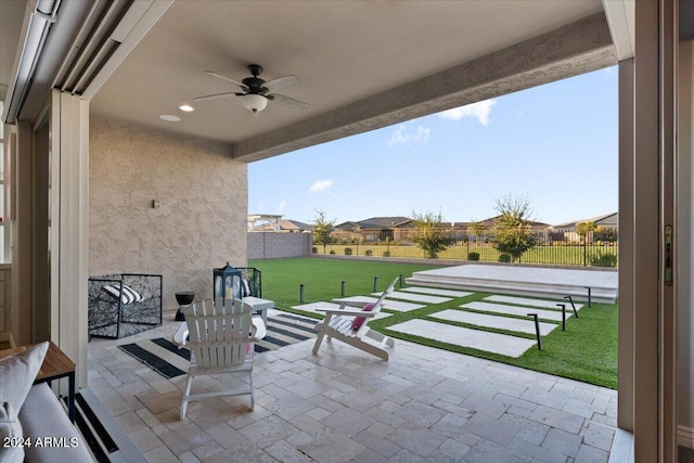 view of patio featuring ceiling fan