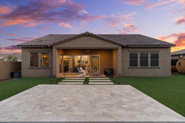 view of front facade with a patio area and a yard