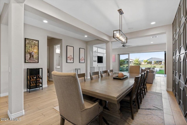 dining space featuring ceiling fan and light hardwood / wood-style floors