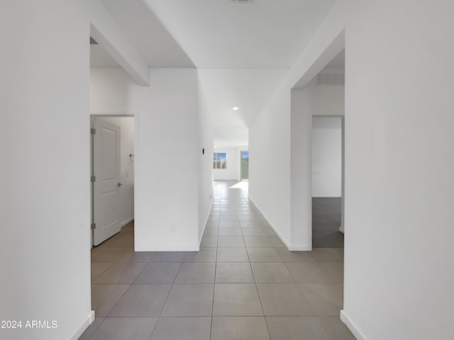 hallway with light tile patterned floors