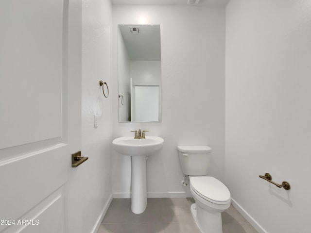 bathroom with tile patterned floors and toilet