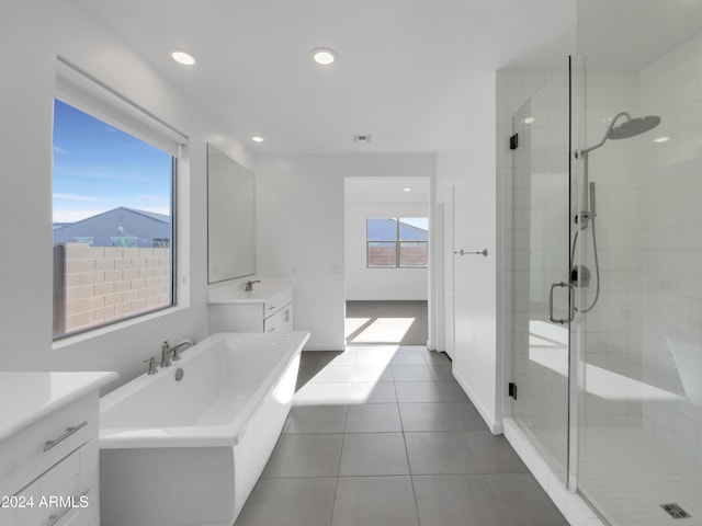 bathroom with tile patterned flooring, vanity, and independent shower and bath