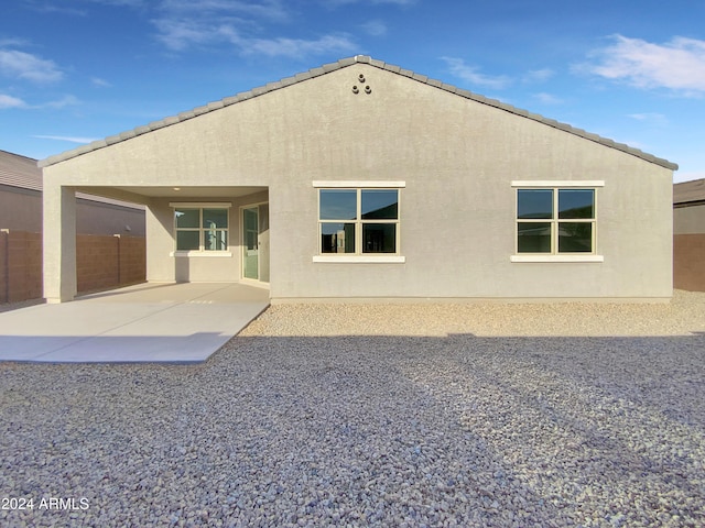 rear view of property featuring a patio