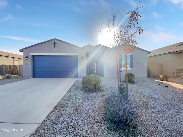 ranch-style home featuring a garage