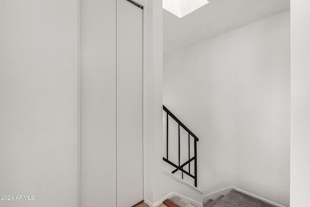 stairway with a skylight