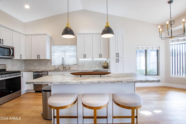 kitchen with sink, white cabinets, and stainless steel appliances