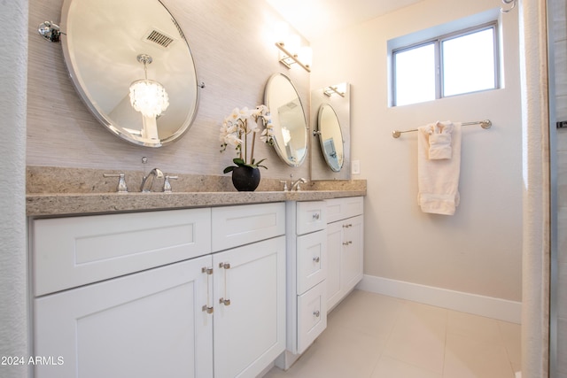 bathroom with tile patterned flooring and vanity