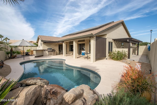 view of pool featuring a patio, area for grilling, and grilling area