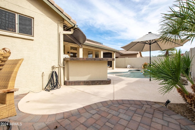 view of patio featuring a fenced in pool