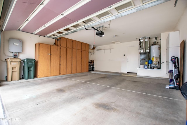 garage featuring a garage door opener and gas water heater