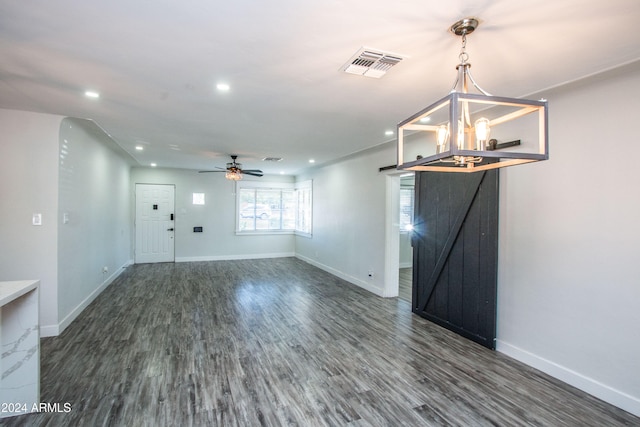 interior space featuring ceiling fan and dark hardwood / wood-style floors