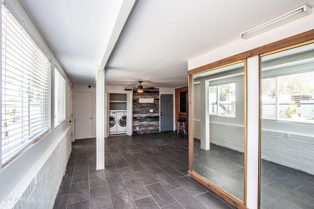 interior space featuring plenty of natural light and washer and dryer