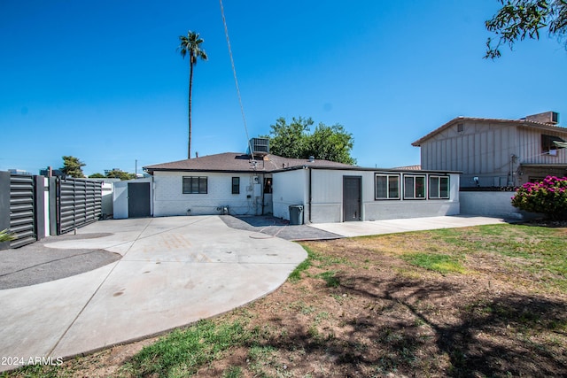 back of house with a patio area and central air condition unit