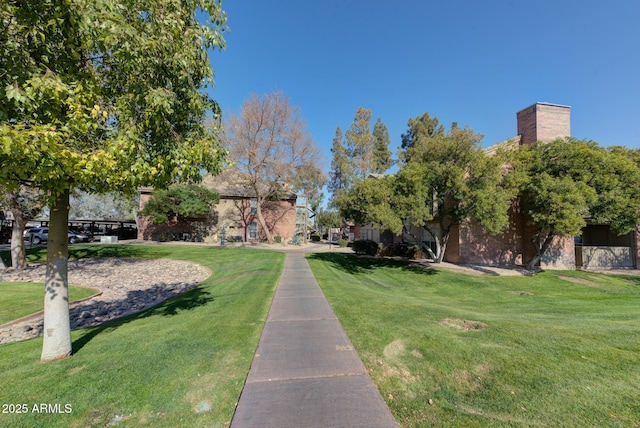 view of home's community featuring a lawn