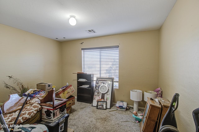 interior space featuring visible vents and light colored carpet