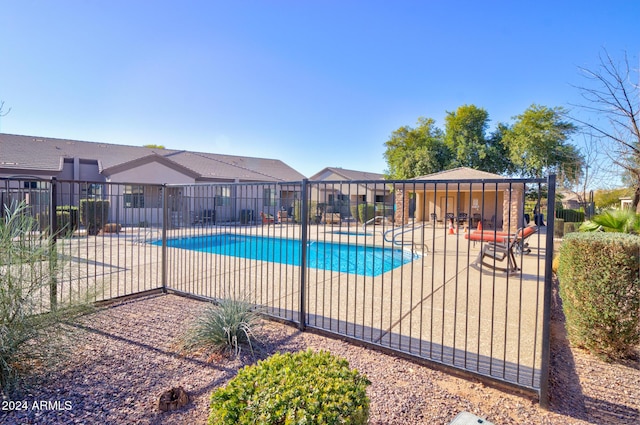 view of pool featuring a patio