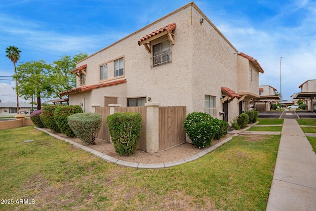 view of home's exterior featuring stucco siding and a tile roof