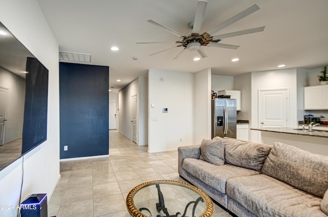 living area with recessed lighting, visible vents, baseboards, ceiling fan, and light tile patterned flooring