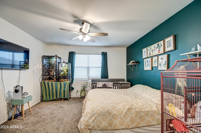 bedroom with a ceiling fan and carpet flooring