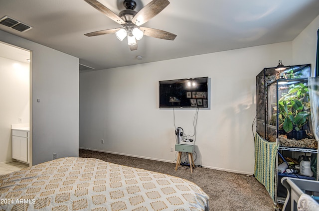 carpeted bedroom featuring visible vents, ceiling fan, and baseboards