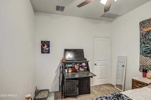 bedroom with visible vents, ceiling fan, and light carpet