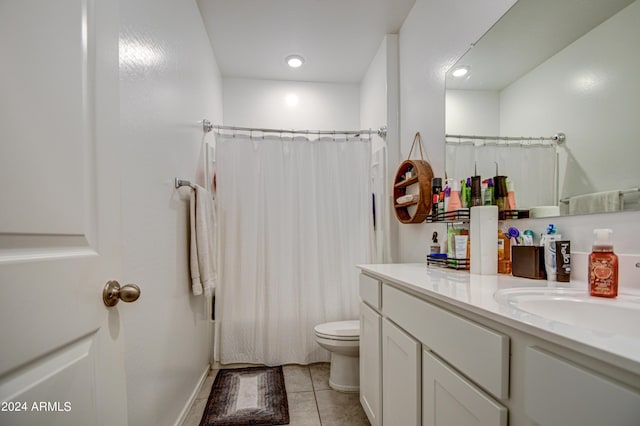 full bathroom featuring tile patterned flooring, shower / tub combo with curtain, vanity, and toilet