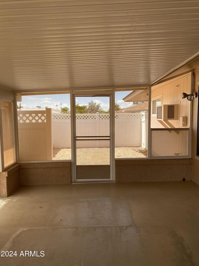 unfurnished sunroom featuring wood ceiling