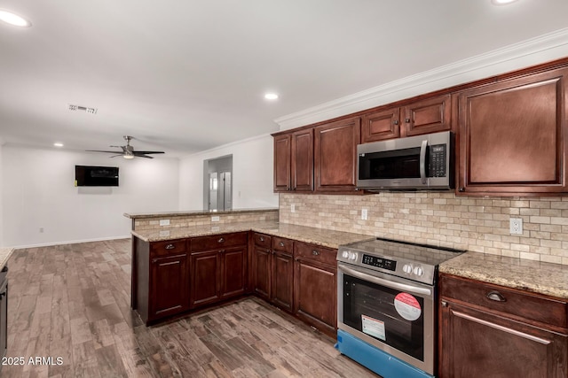 538 W 13th St, Tempe, AZ 85281 - kitchen featuring appliances with stainless steel finishes, backsplash, a ceiling fan, crown molding, and dark wood-style floors