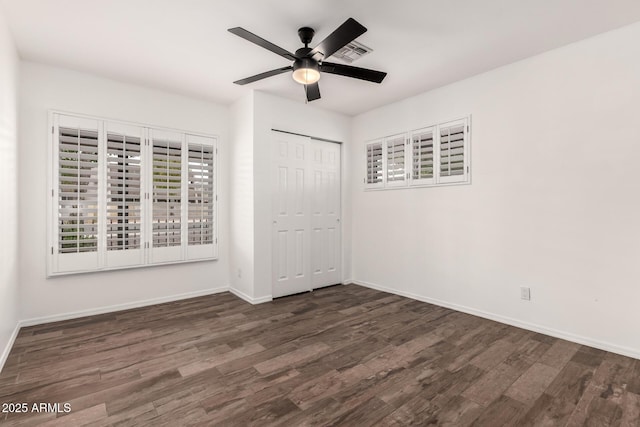 538 W 13th St, Tempe, AZ 85281 - unfurnished bedroom featuring dark wood-style floors, baseboards, and a closet