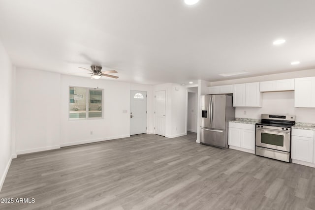 538 W 13th St, Tempe, AZ 85281 - kitchen with stainless steel appliances, ceiling fan, light wood-style flooring, recessed lighting, and white cabinetry