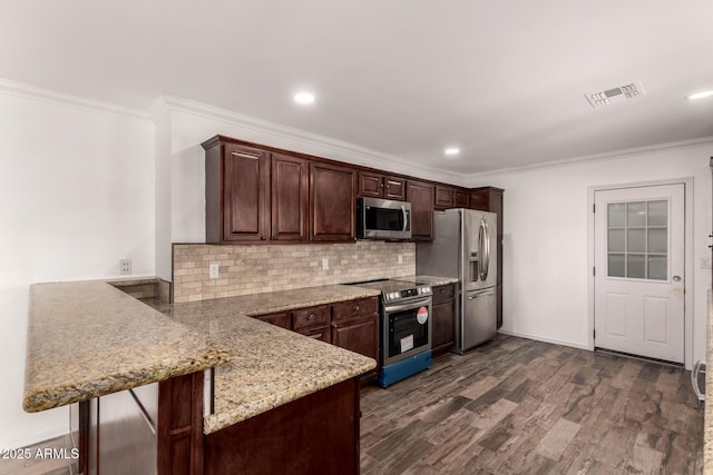 538 W 13th St, Tempe, AZ 85281 - kitchen with appliances with stainless steel finishes, a peninsula, ornamental molding, backsplash, and dark brown cabinets