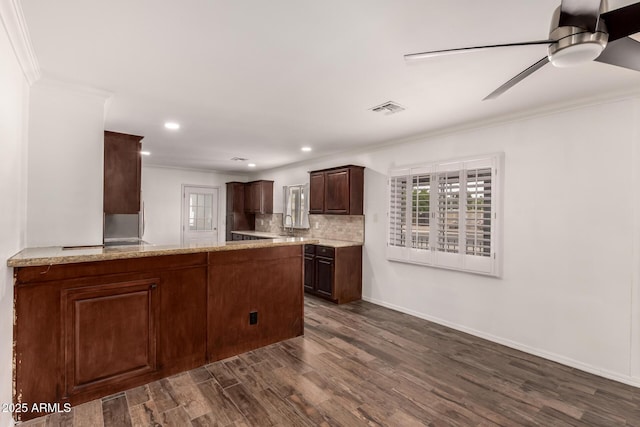 538 W 13th St, Tempe, AZ 85281 - kitchen with ornamental molding, ceiling fan, dark wood-type flooring, dark brown cabinets, and tasteful backsplash