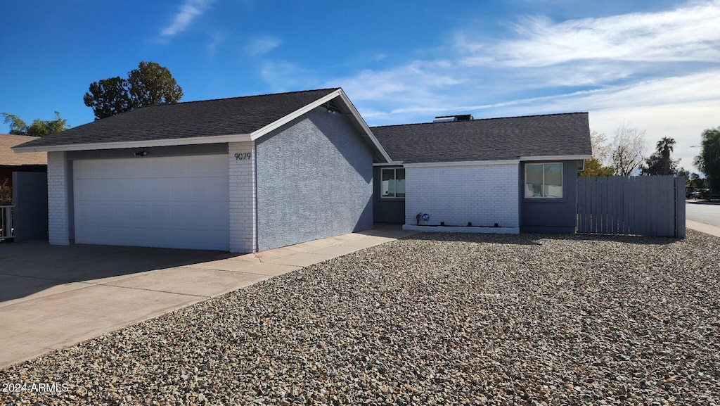 ranch-style house featuring a garage