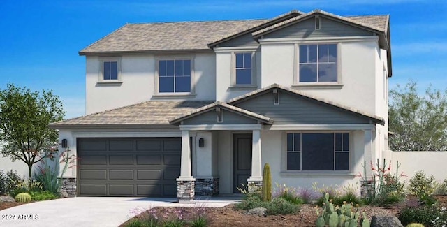 traditional-style house featuring a garage, stucco siding, and concrete driveway