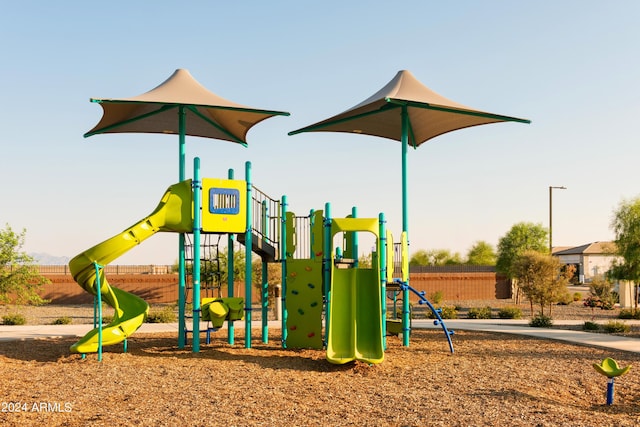 community jungle gym featuring fence
