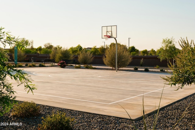 view of basketball court featuring fence and community basketball court
