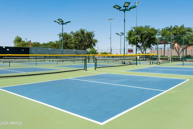view of sport court featuring fence and community basketball court