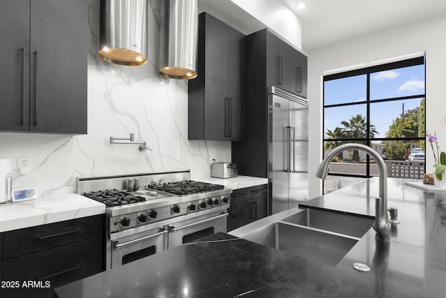 1807 E Campbell Ave, Phoenix, AZ 85016 - kitchen with high end appliances, dark cabinetry, and light stone countertops