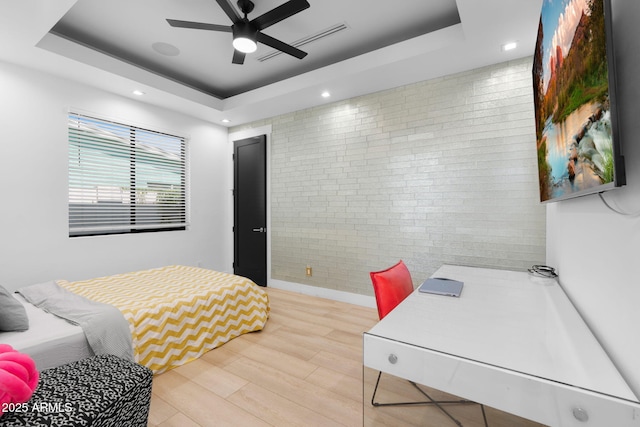 1807 E Campbell Ave, Phoenix, AZ 85016 - bedroom with a tray ceiling, light wood-style flooring, recessed lighting, ceiling fan, and an accent wall