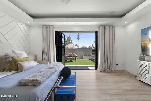1807 E Campbell Ave, Phoenix, AZ 85016 - bedroom with wood finished floors, access to exterior, a tray ceiling, and recessed lighting