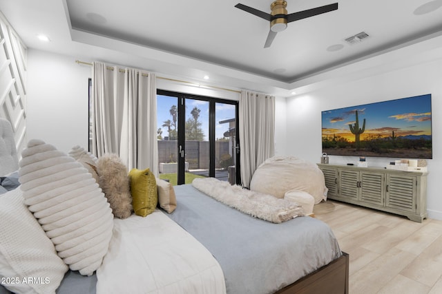 1807 E Campbell Ave, Phoenix, AZ 85016 - bedroom with access to exterior, a tray ceiling, light wood finished floors, recessed lighting, and ceiling fan