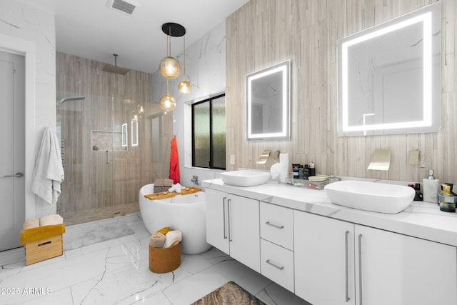 1807 E Campbell Ave, Phoenix, AZ 85016 - bathroom featuring a stall shower, double vanity, marble finish floors, and a freestanding tub