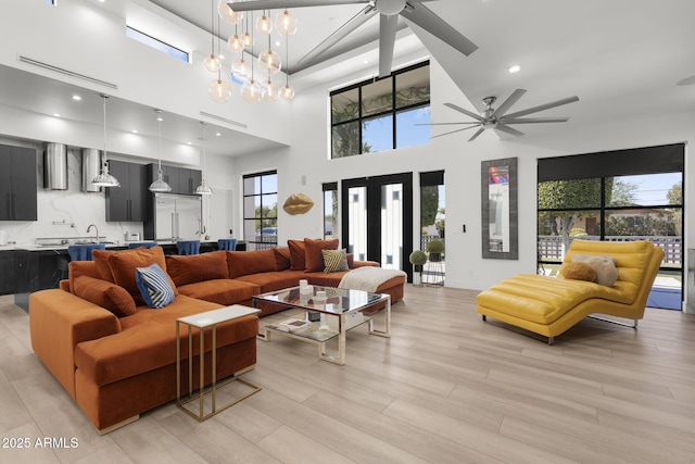 1807 E Campbell Ave, Phoenix, AZ 85016 - living area with ceiling fan, plenty of natural light, light wood-type flooring, and a high ceiling