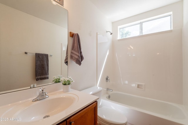 bathroom with shower / bath combination, vanity, and toilet