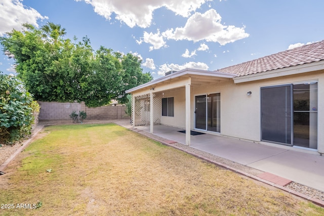 view of yard featuring fence and a patio area