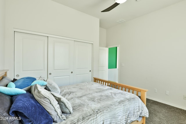 bedroom with ceiling fan, a closet, and carpet