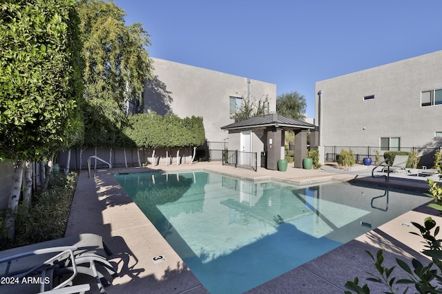 view of pool with a gazebo and a patio