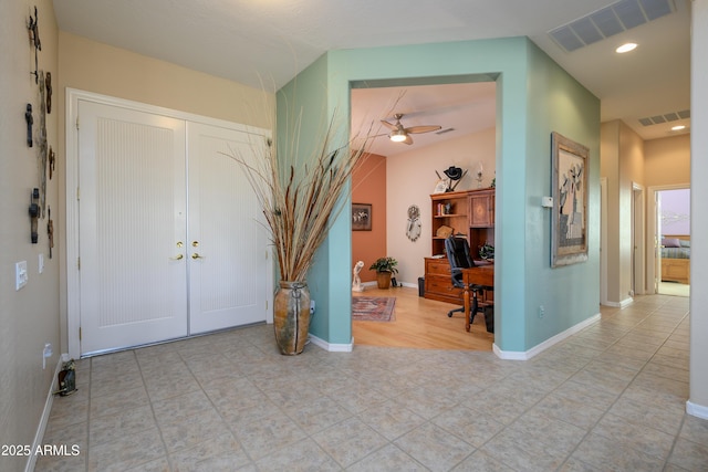 entryway with french doors and ceiling fan