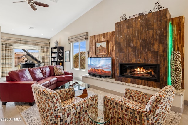 living area featuring recessed lighting, a large fireplace, a ceiling fan, baseboards, and visible vents